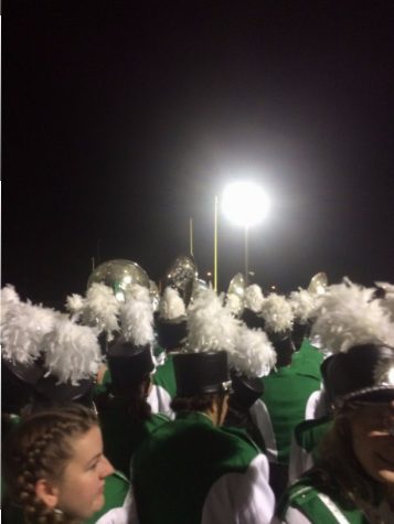 Before each halftime show, the band would huddle up by the north field goal and have a pep talk. Here is a picture of one of their pep talks.