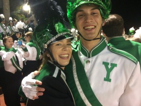 Drum major Amy Letavay and Angelo Buscaglia, seniors, are all smiles as they get ready for their last halftime performance as a duke. 