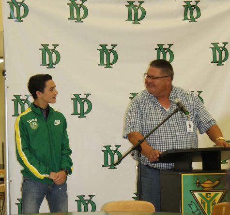 Junior Jackson Bode, Student of the Month for Industrial Tech, is introduced by Mr. Ken Ross.