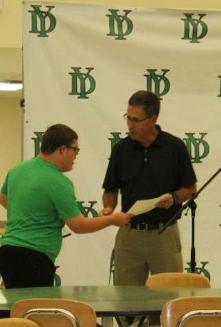Alexander Hamilton, Student of the Month for York Student Services, accepts his certificate from Mr. Mike Hanley.