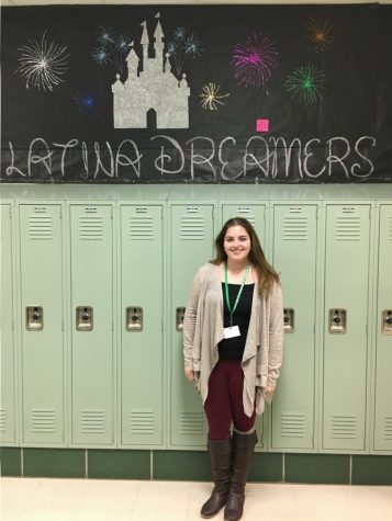 Senior and club member, Isabella Raimondi, stands by this year's Latina Dreamers' homecoming hallway display.