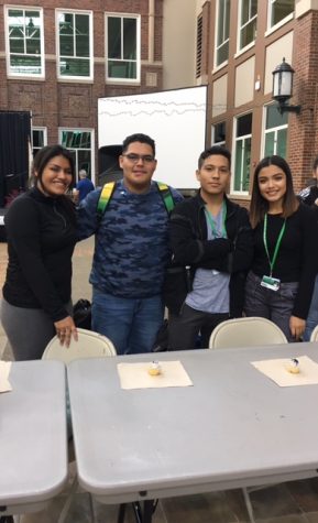 (From left to right) Celeste Avila, Leo Avila, Jose Guzman, and Lessly Diego set up the food eating contest this Thursday in which students compete in eating a cupcake without using their hands.
