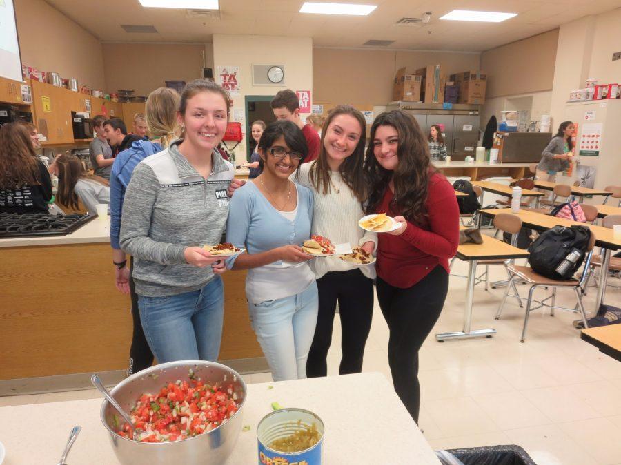 Students pose with their nacho creations during Chefs Corner.