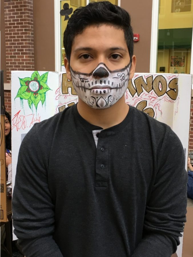 Senior and Hispanos Unidos member, Jose Guzman, got his face painted by senior and Latina Dreamers member, Lessly Diego, to celebrate and represent Dia de Los Muertos or Day of the Death.