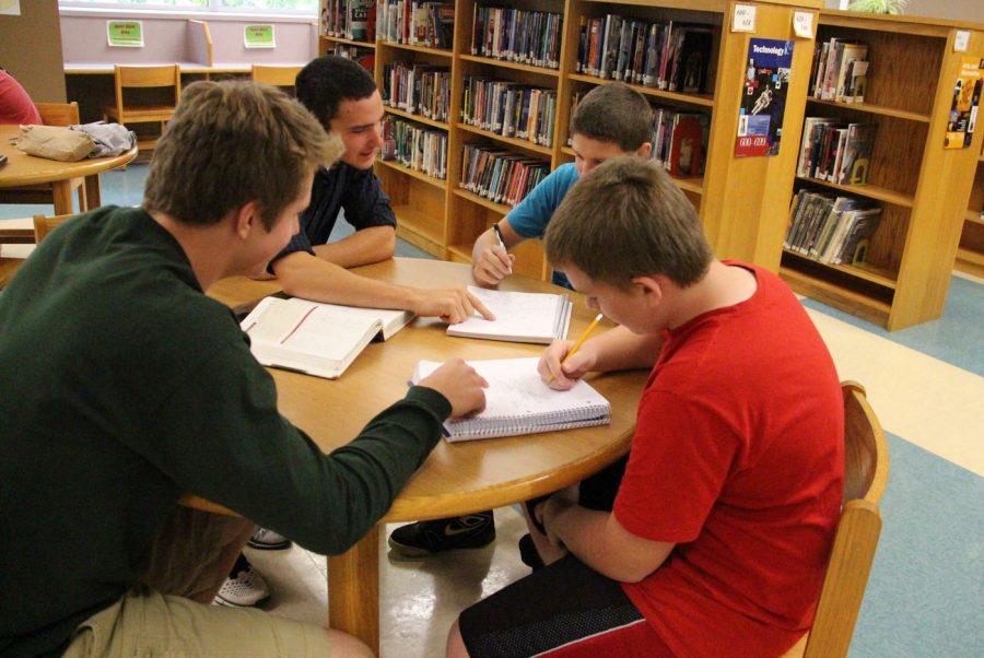 Students help each other study. | Photo Courtest of Google Images