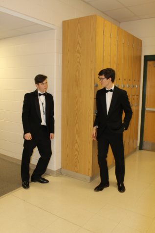 Juniors Chuck Miller and Sam Griffin in their band suits before the concert. 