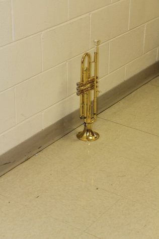 A lonesome trumpet left in the band room to survive on it's own. 