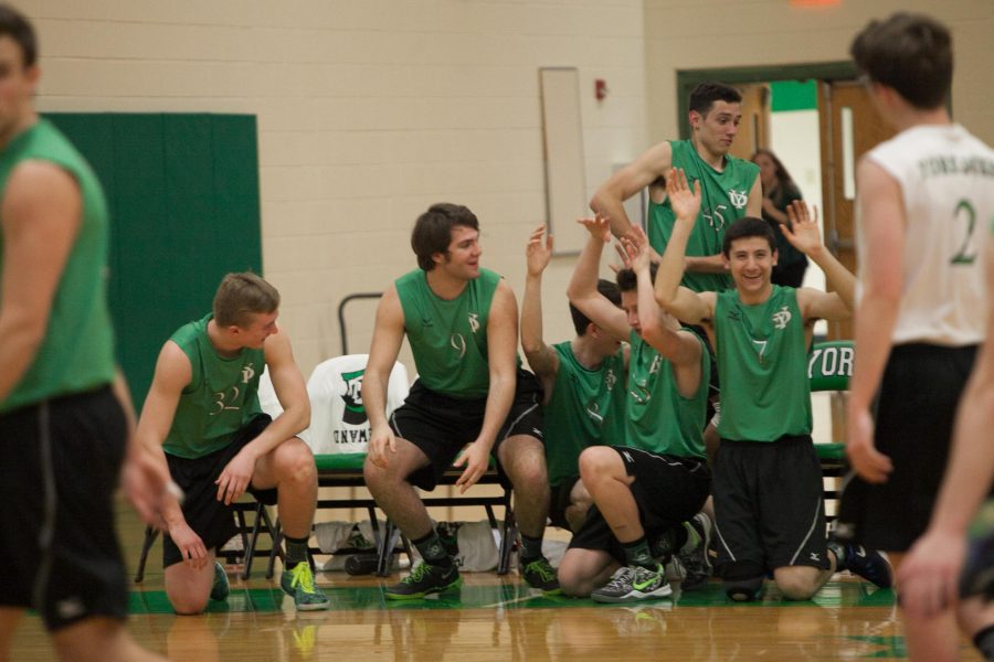 The bench celebrates its teammates with a cheer.