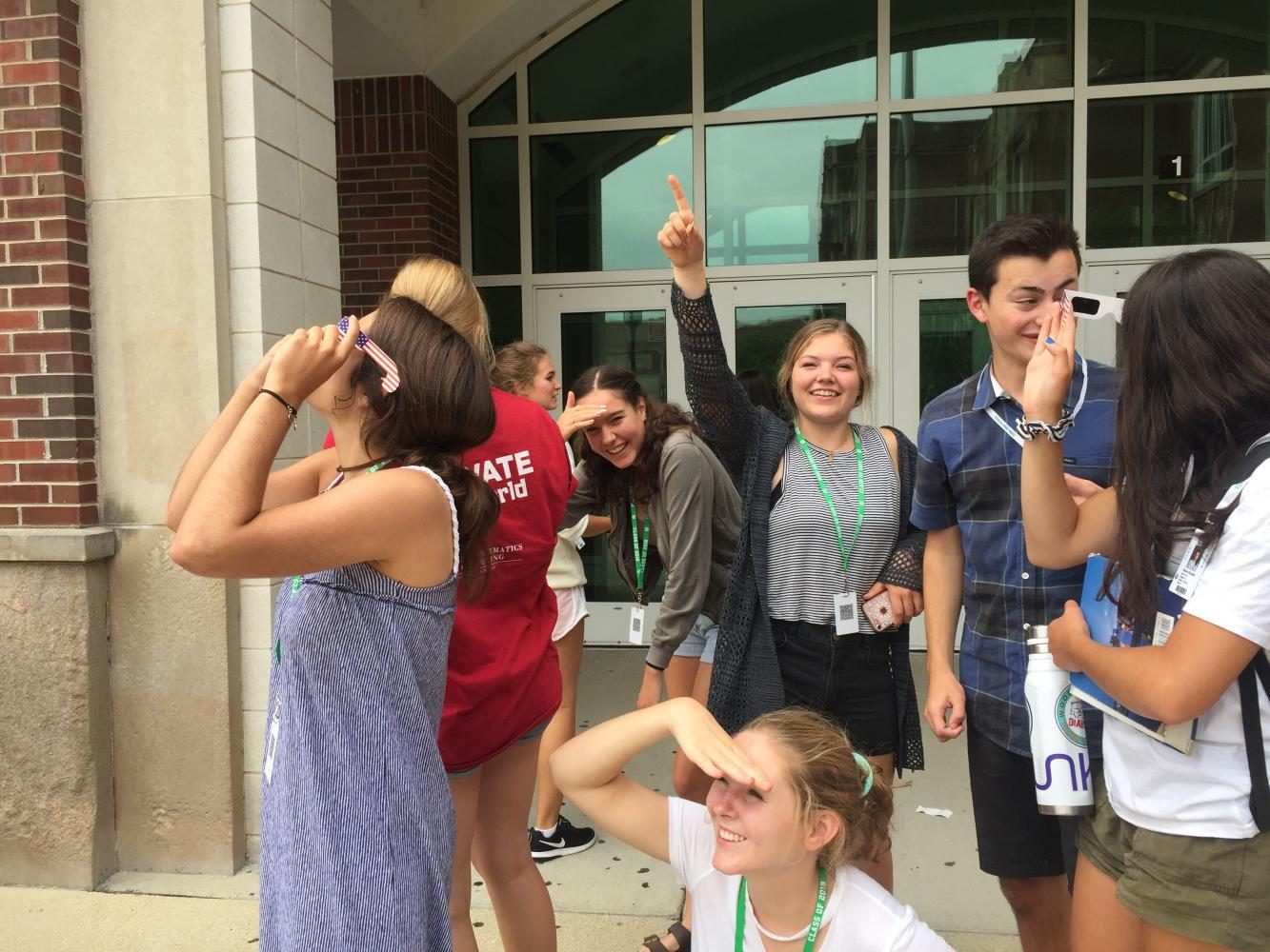 Group of choir students marvel at the solar eclipse during 6th period.