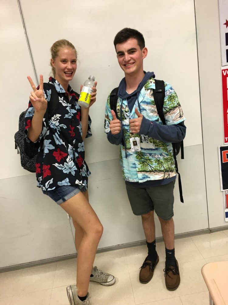 Sophomores Audrey Sylvester (left) and Aidan Frank (right) in their Hawaiin button downs on Tues. Sept. 19.