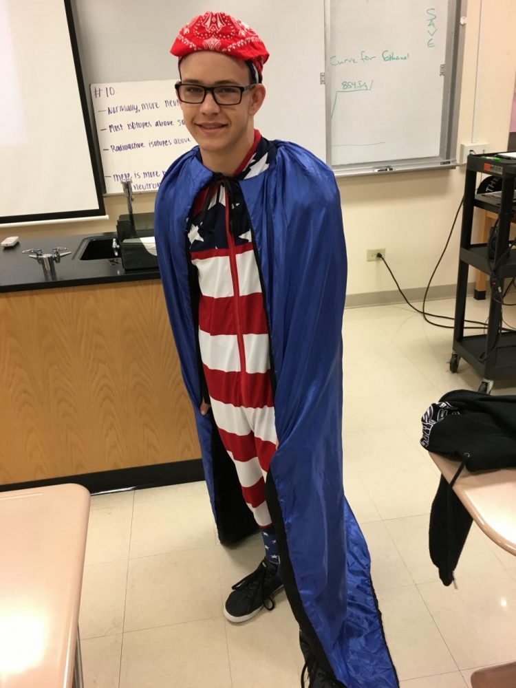 Sophomore Sam Jensen goes all out with his patriotic and Duke spirit by wearing a cape, onsie, bandanna, and star spangled socks on Wed. Sept. 20.