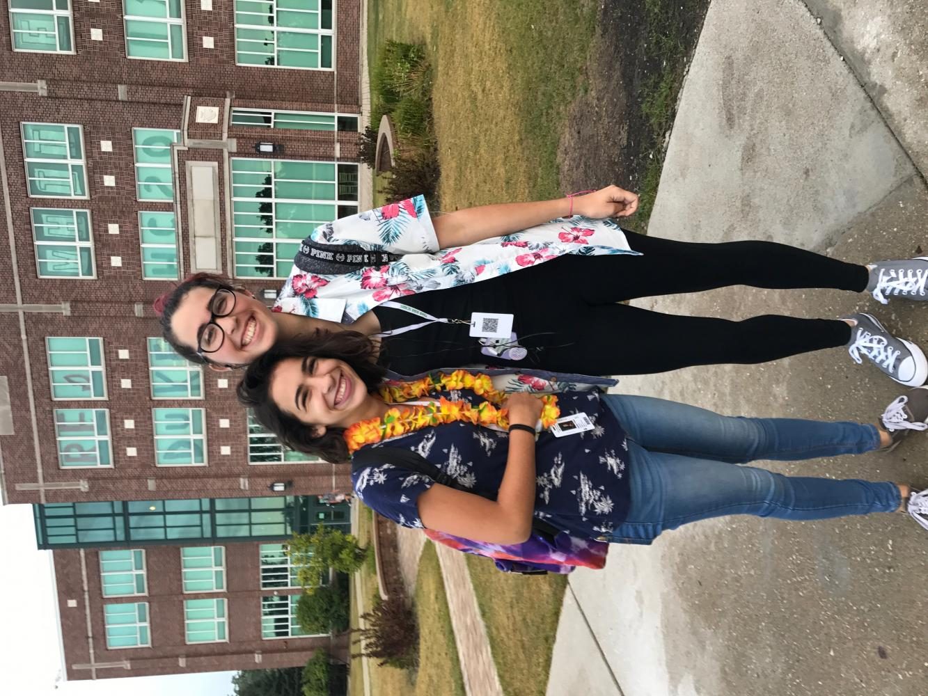 Sophomores Sophia Fisher (left) and Catherine Evans (right) dress up in Hawaiian to show their school spirit on Tuesday Sept. 20, 2017.