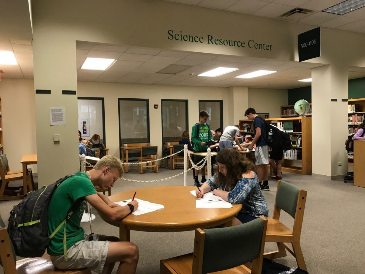 Sophomores fill out forum questions in York Learning Commons. Sept. 26, 2017.