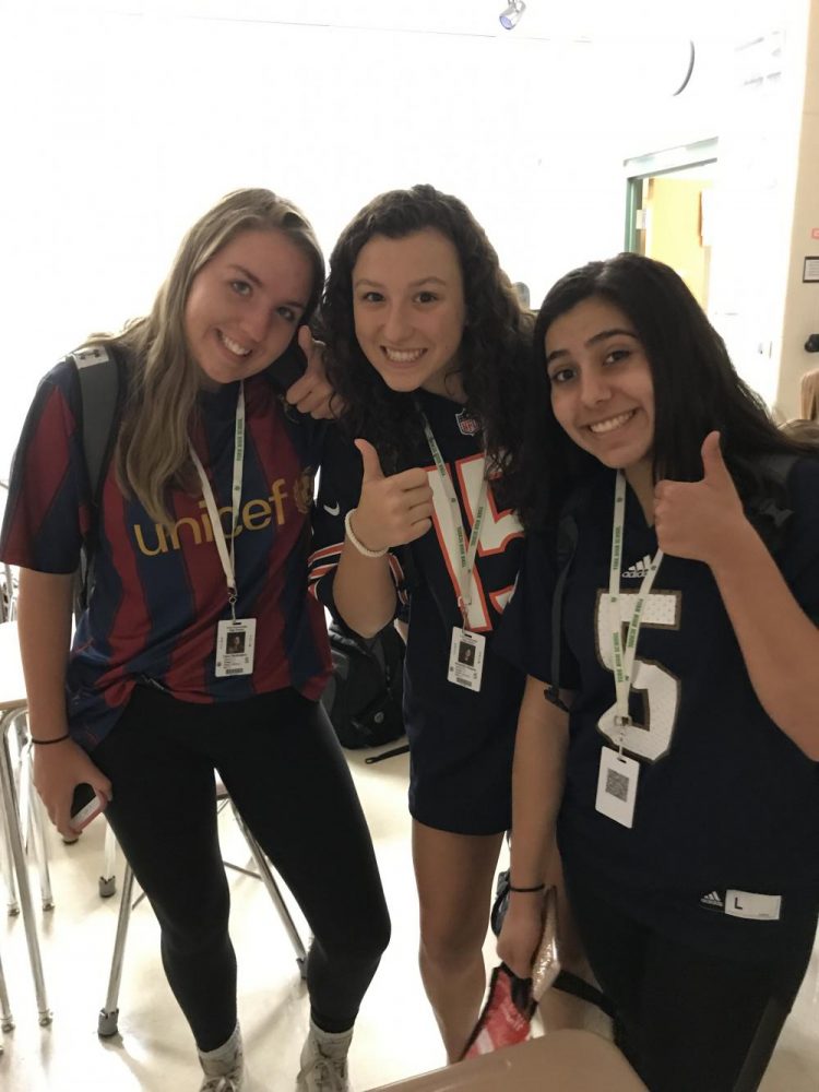Sophomores Cara McGovern, Amanda Polach, and Natalie Rinchiuso sport their jerseys for Jersey Day. Thurs., Sept. 21, 2017. 