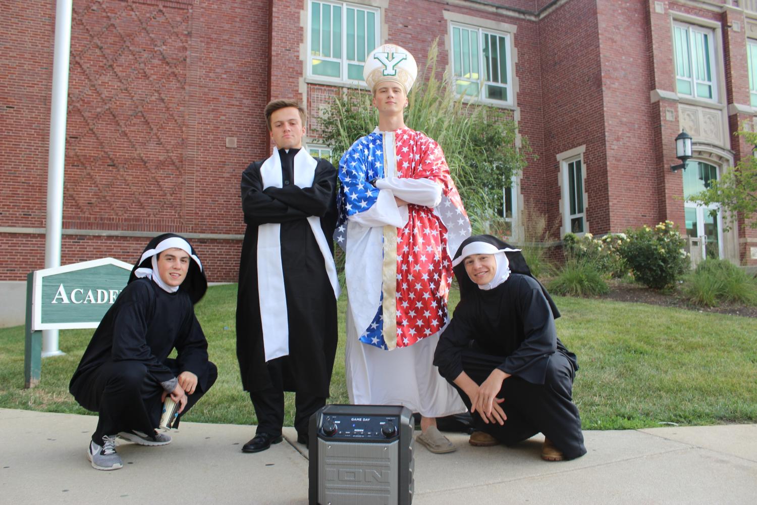 Members of King of the Couch group Holy Dukes (from left) Ryan Costello, Ben St. Clair, Tyler Sidoryk and Aidan Gawne are blessing York students with Duke Spirit.