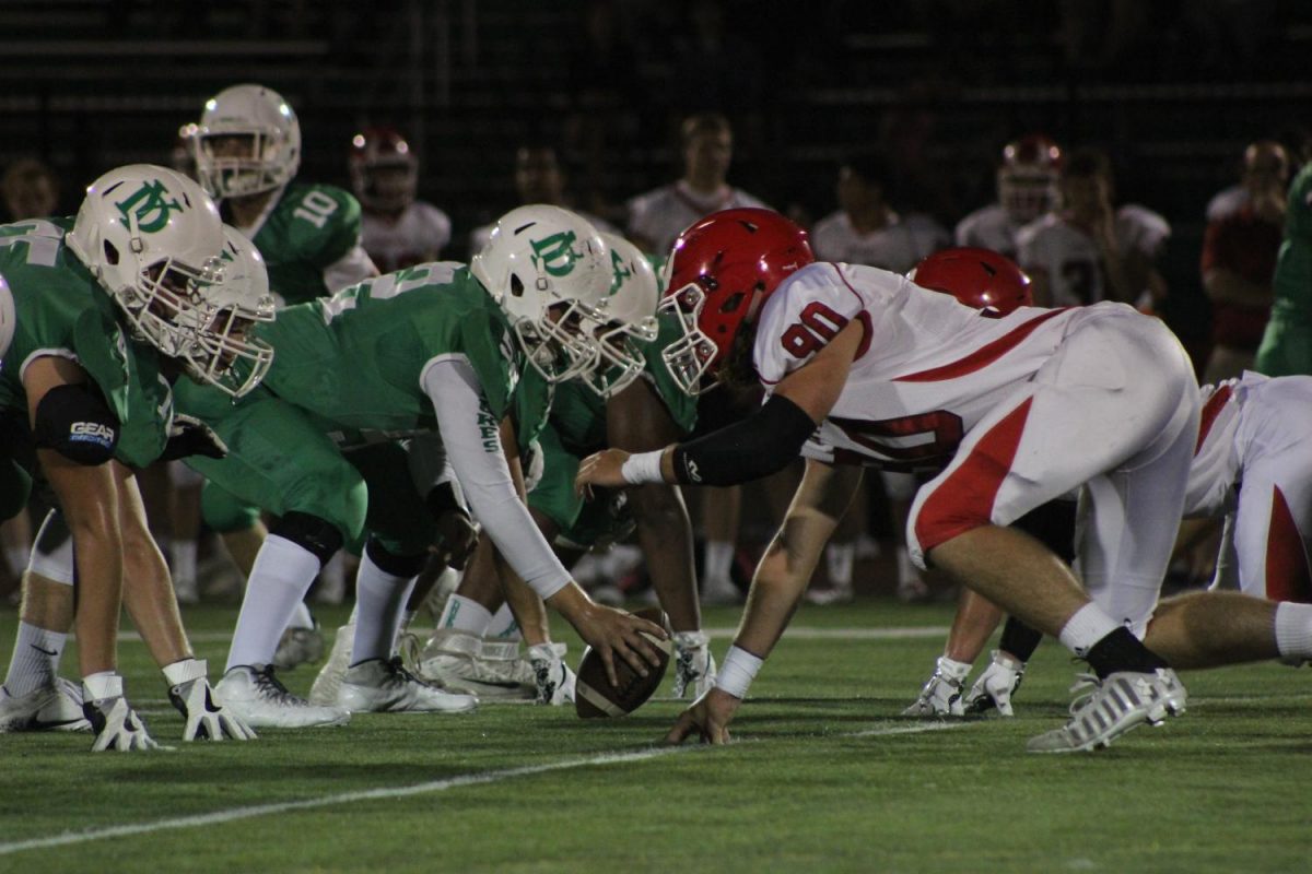 York High School and Hinsdale Central get in their positions for the next line of scrimmage at the Homecoming football game. Fri., Sept. 22, 2017