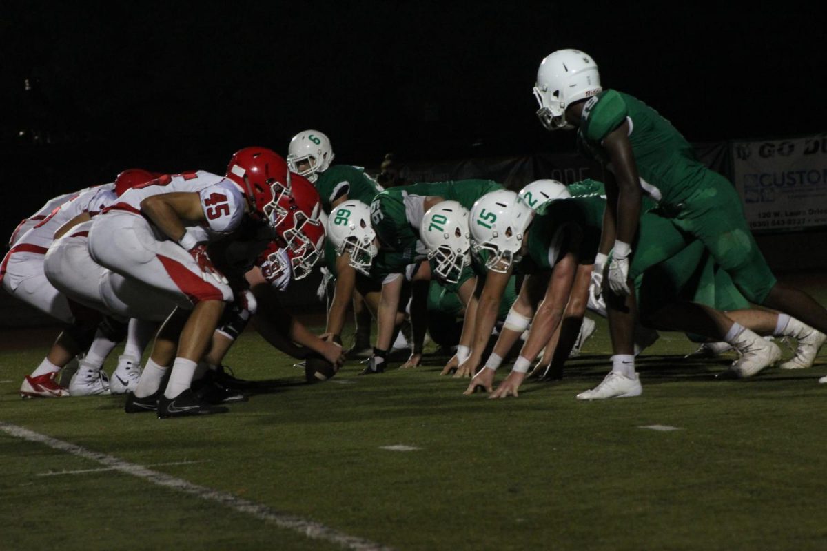 York High School and Hinsdale Central position themselves for a line of scrimmage at the Homecoming football game. Fri., Sept. 22, 2017