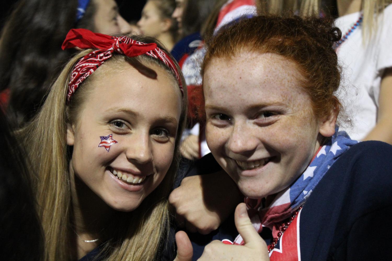 Juniors Maddie Wells and Bridey Costello sporting patriotic spirit wear to cheer on the Dukes.