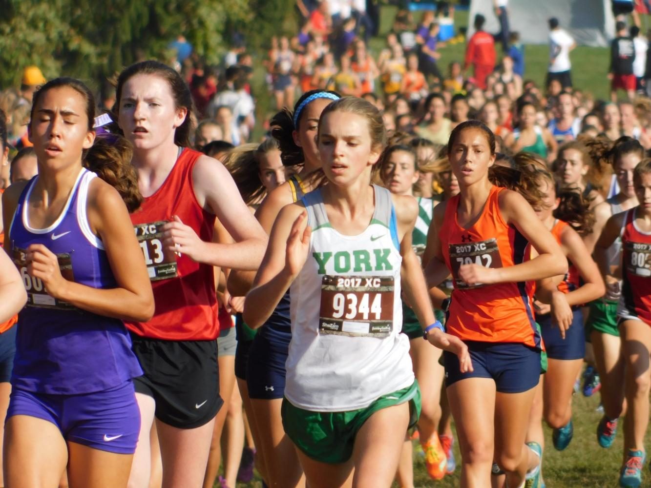 Gia Stephan, freshman, strides to the front of the pack at the second mile during the Frosh/Soph race
