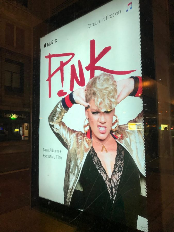 Apple Music displays an advertisement to buy P!nks new album, Beautiful Trauma, at the La Salle bus station in Chicago.