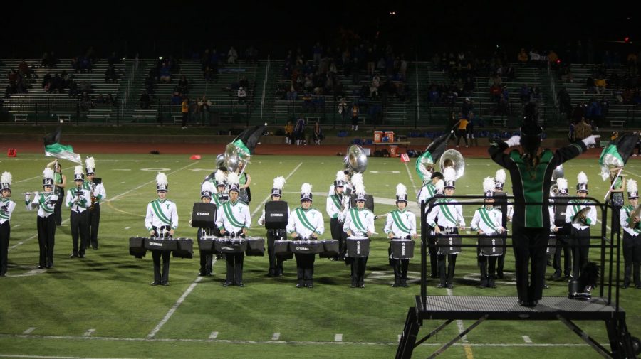 Marching band wraps up their season on rainy field