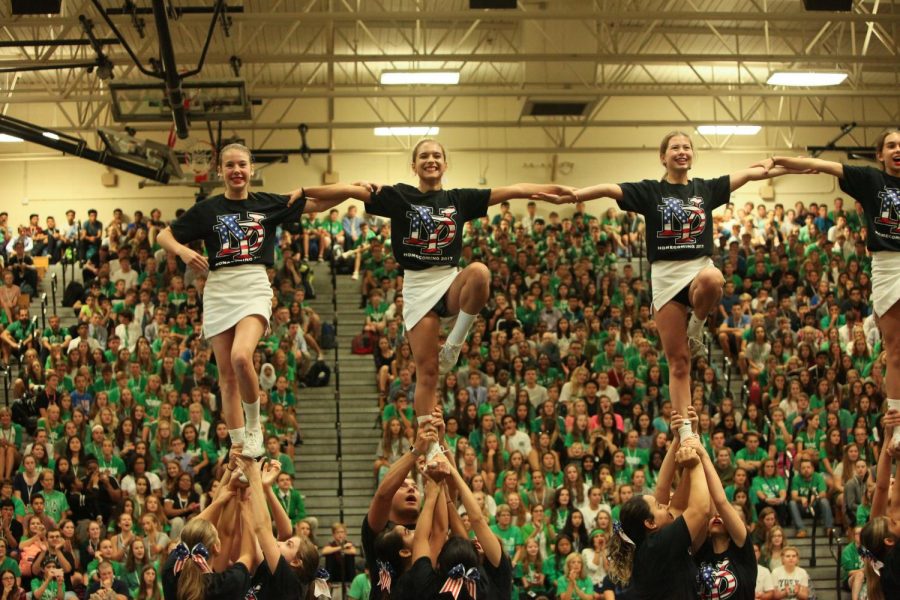York cheer flyers show off their skills as they pull libs in the air at homecoming pep-rally. 
Photo courtesy of Stuart Rodgers Photos
