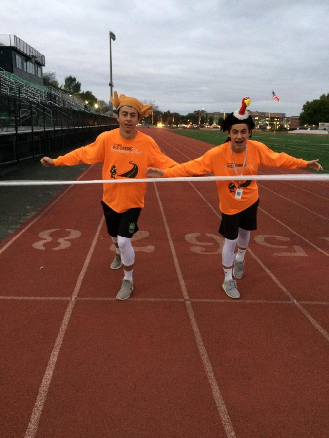 Brothers Joe Chornij (senior) and Steve Chornij (sophomore)  cross the finish line  to win the turkey trot and  the costume contest