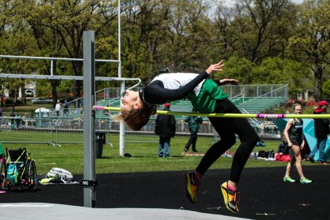 Junior, Nicki Anderson, soars high above the high jump bar during the West Suburban Conference Meet, finishing third for the frosh/soph team. May 3, 2017.