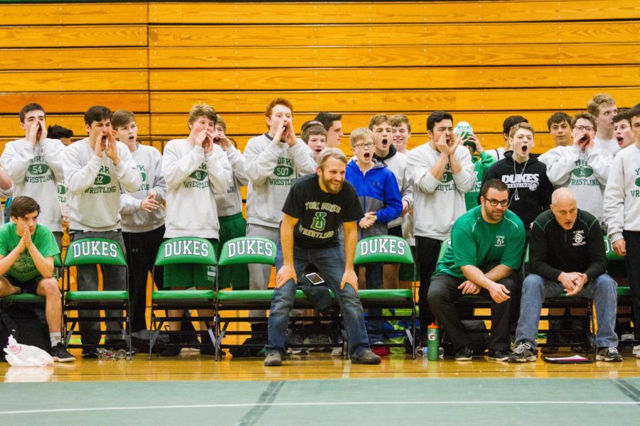 All levels of dukes wrestling gather to cheer on their final wrestler for the night. 