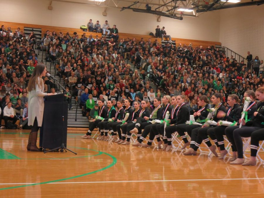 Coach+Kristen+Baron+honors+the+poms+team+at+the+pep+rally+celebrating+their+2018+state+championship.+Feb.+2%2C+2018.