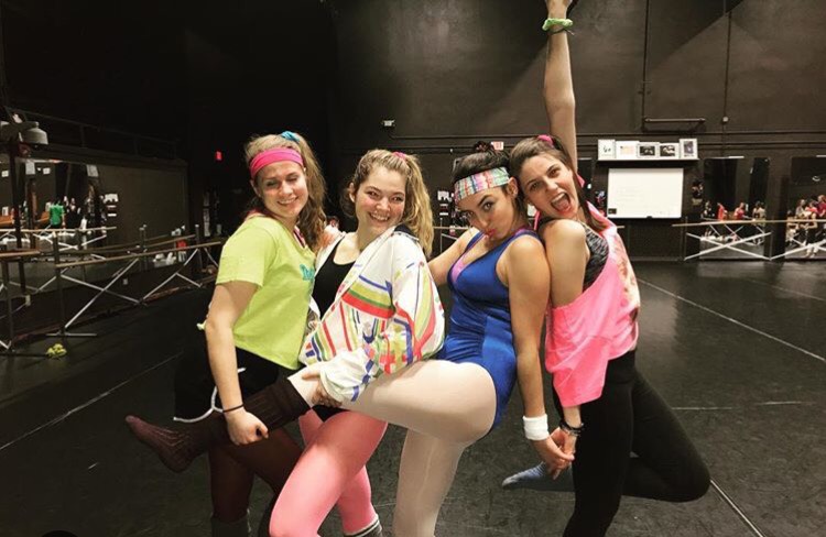 Seniors (from left to right) Olivia Braun, Danielle Fite, Jackie Meyer, and Abbie Lockie sporting their 80’s outfits to match Monday’s choreo week theme.