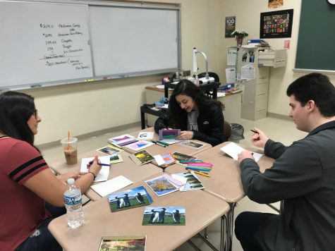 Interact Club President, William Parpan, writes encouraging letters to Parkland students with fellow members.