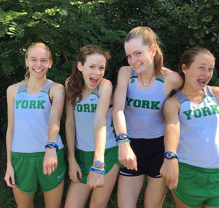 Sophomores (from left to right), Emma Kern, Lydia Hickey, Abby Moriarty and Maggie Clink show off their chronographs, which they have accessorized with bracelets and hair ties, at the Leavey Invitational. Sept. 2, 2017 