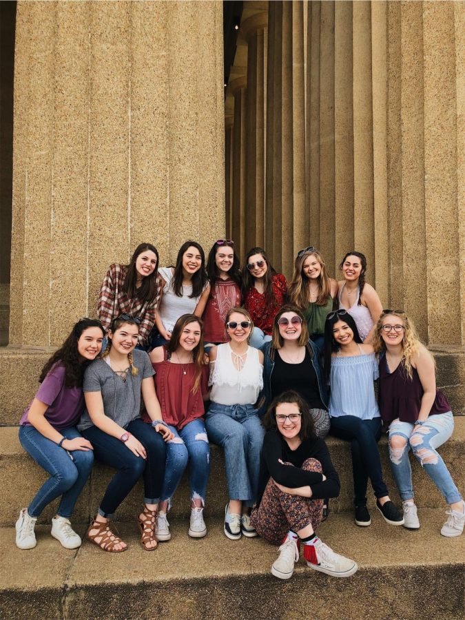 A group of Concert Choir senior girls in front of the Parthenon. 