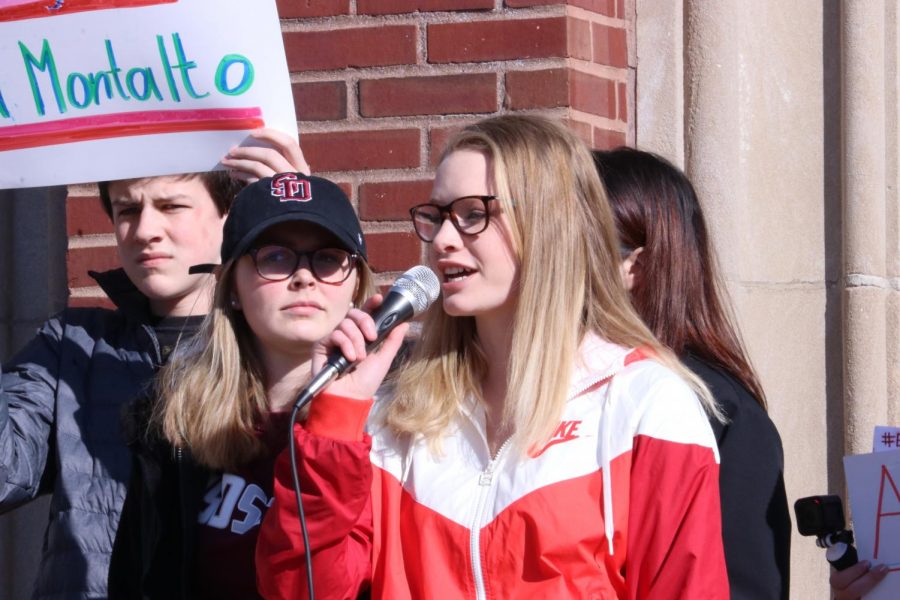 Senior Olivia Pechous speaks for immediate gun reform at the all-school walkout. Wed., March 14, 2018