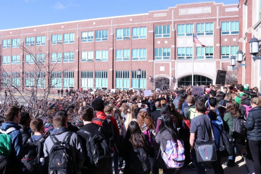 In a sea of red and black, York students proudly participate in a historic nationwide walkout. Wed., March 14, 2018