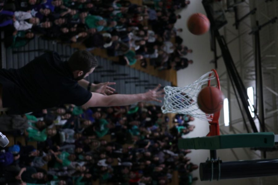 Mr. Giuliani shoots hoops during the Knockout portion of the pep rally. 