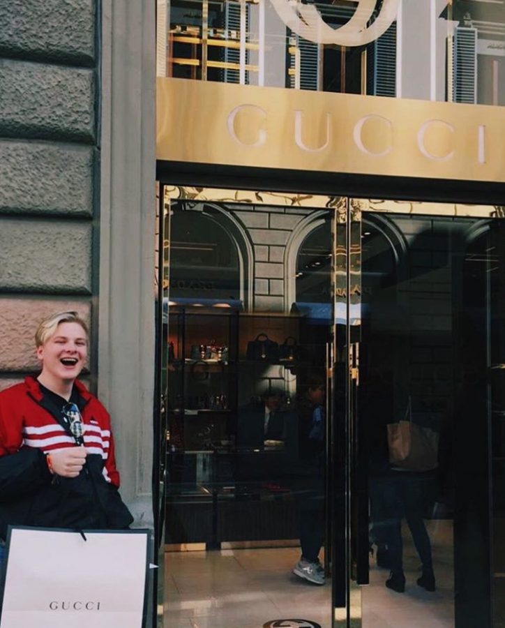 Junior Michael Regan posing for a picture in front of a Gucci store in Florence, Italy.