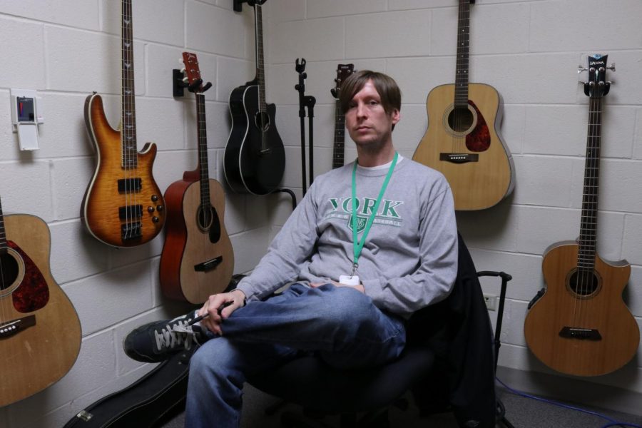 Mr. Chris Gemkow, an icon of Yorks music scene, has his collection of various acoustic and electric guitars display his passion for music as they hang in his office.
