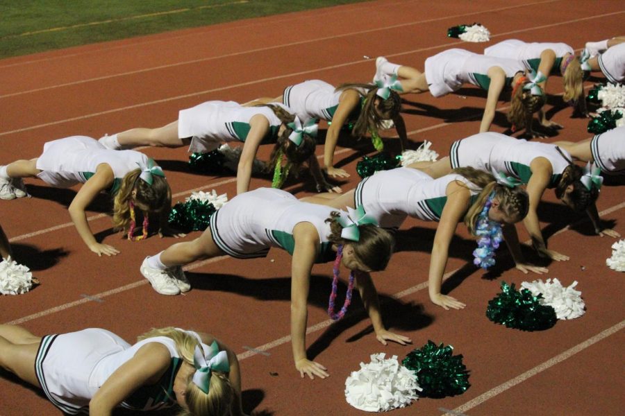 The cheerleaders do push-ups to celebrate one of Yorks touchdowns. 