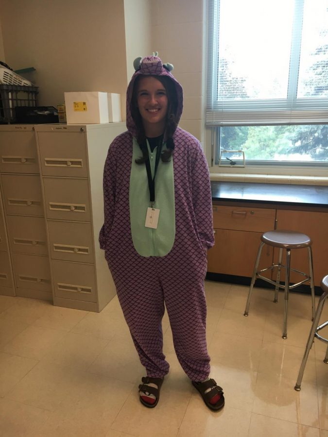 Senior Faith Shiley supporting pajama day in her dinosaur onesie. Photo by Isabelle Downey 