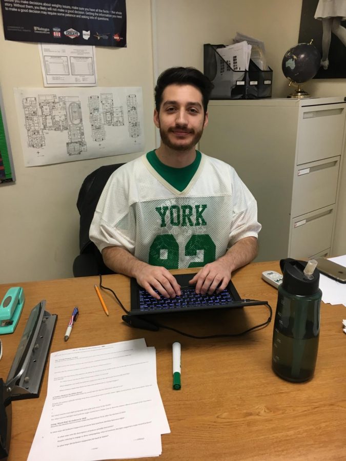 Mr. Green, social studies teacher, rocks an old York football jersey for the blast from the past spirit day. Photo by Isabelle Downey 