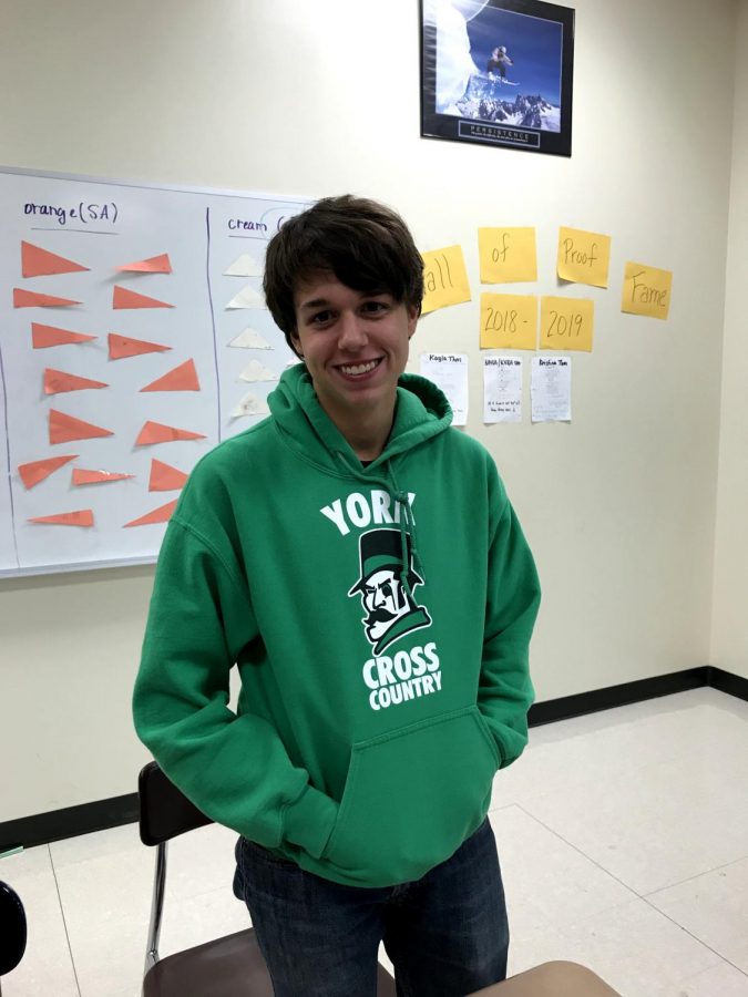 Junior Matt Tully is full of duke spirit in his green cross country sweatshirt.