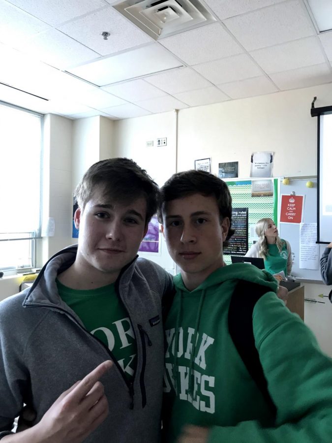 Juniors Nick Pomatto and Kevin Lawrence take their spirit days seriously as they wear York gear for green and white day. 