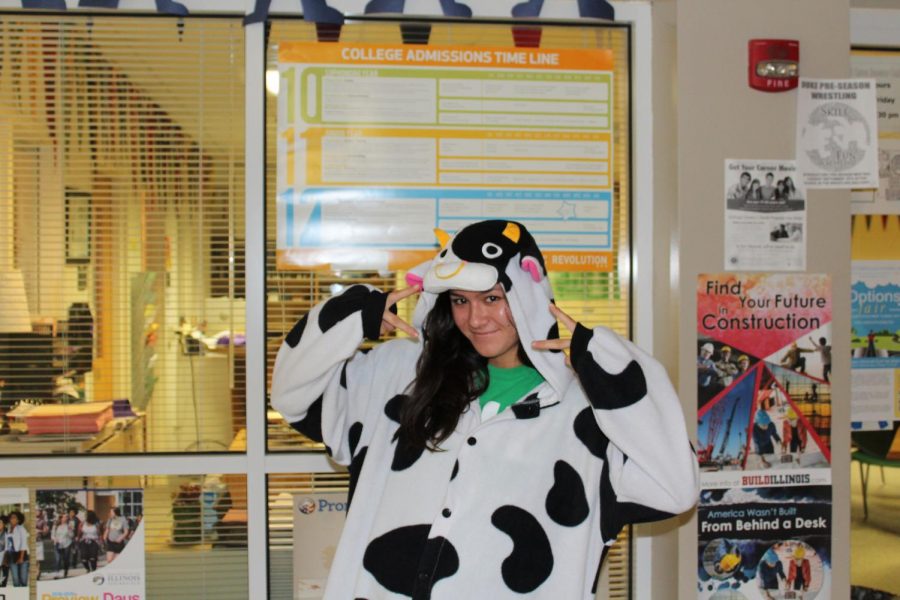 Senior Sam Kao dresses in a cow onesie in an effort to stay comfy for pajama day. Photo by Gracie Weinstein 