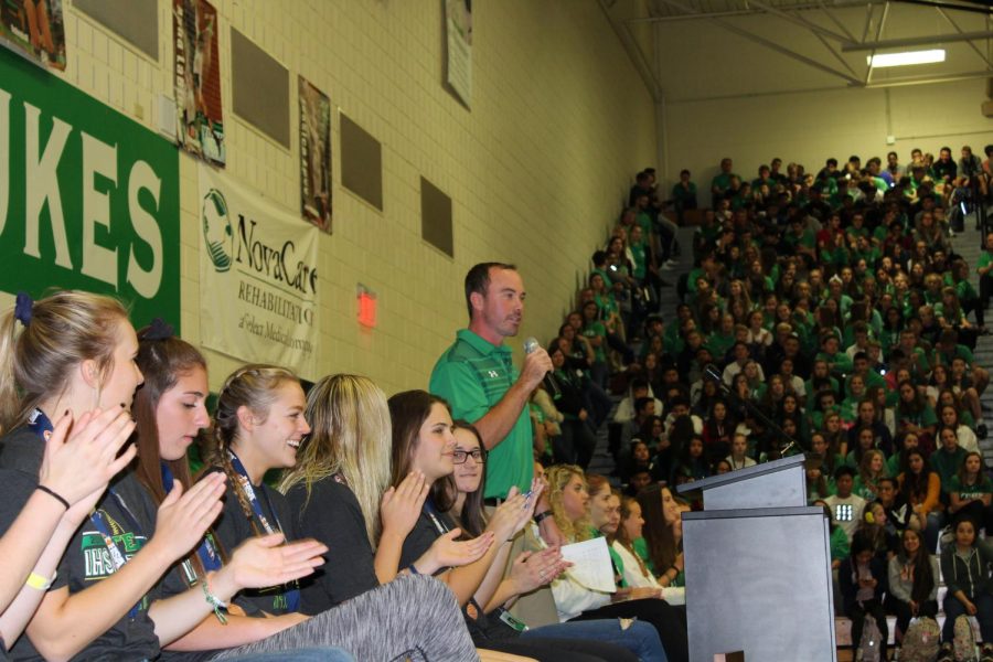 Head coach Michael Fitzpatrick leads the crowd in excitement for tonights game. 