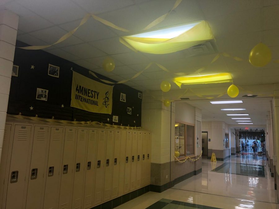 The finished Amnesty International hallway has a theme of black and yellow modeling the colors of their flag 