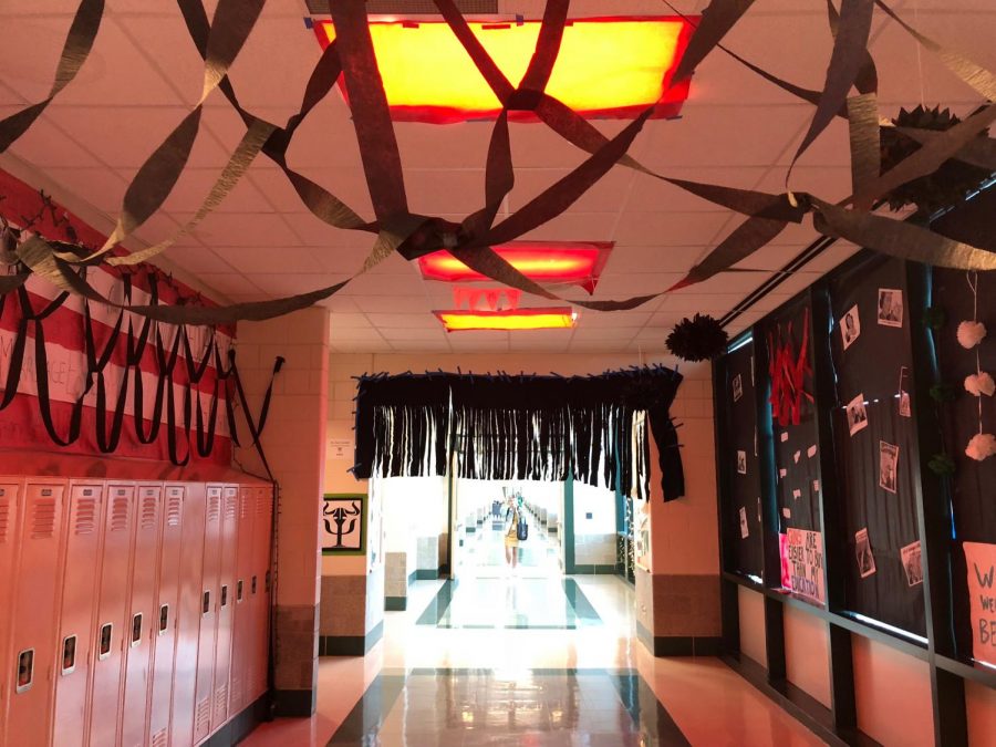 The first part of the Empower hallway is covered in black with black butcher paper covering the windows symbolizing all of the obstacles and setbacks women had to face over the course of history