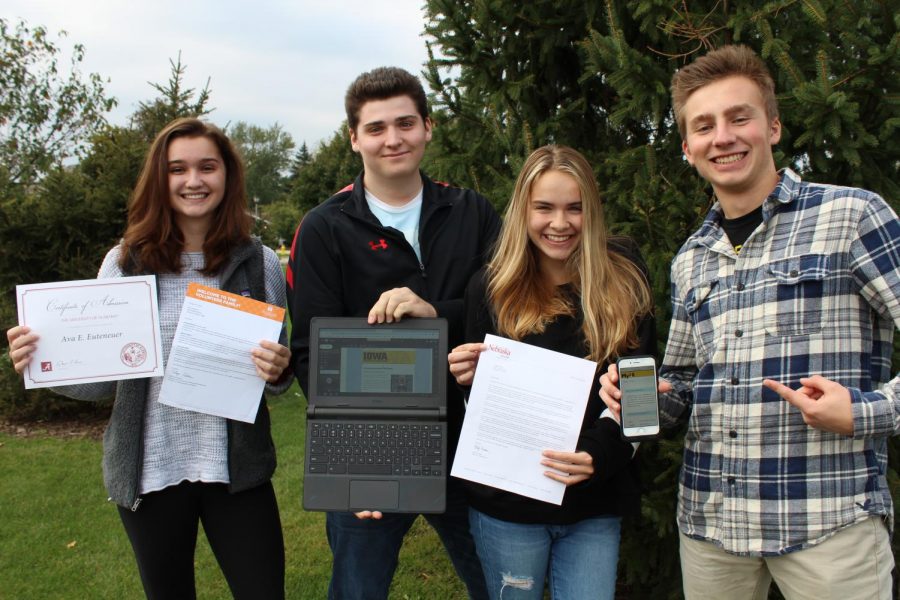 Seniors Ava Euteneuer, Liam Parpan, Noelle Pedote, and Connor Saurbier show off their acceptance letters and emails to the University of Alabama, the University of Tennessee, Knoxville, the University of Nebraska-Lincoln, and the University of Iowa.
