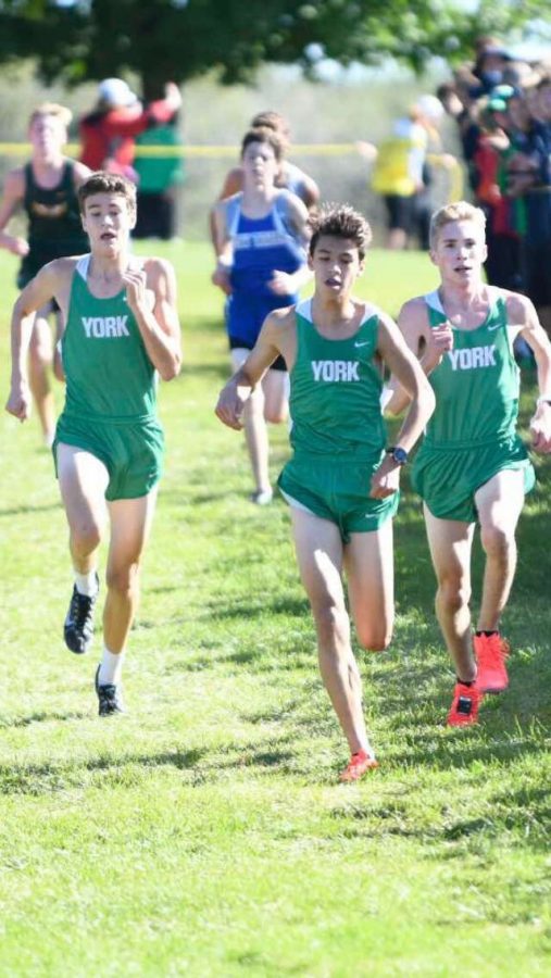 Left to right: Thomas Braun, Sam Ayers, And Mickey Vreeland pull away from the pack in the last 400 meters, racing each other all the way to the finish. Photo courtesy of colinbphoto.
